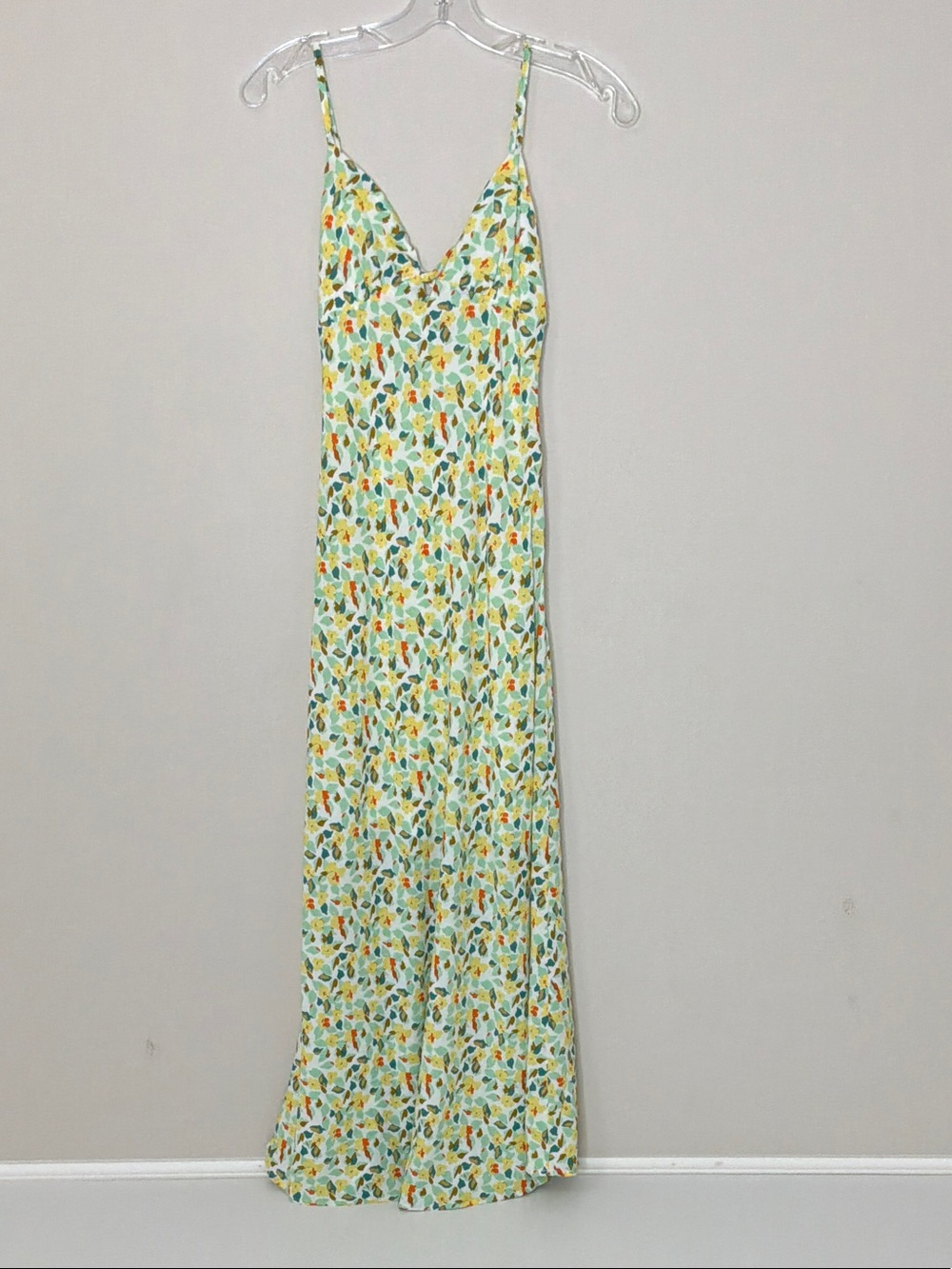 Floral Cutout Maxi Dress in white with green, yellow and orange floral print.
